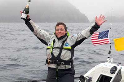 Sarah Outen breaks out the champagne. (Pic by James Sebright / www.sarahouten.com)