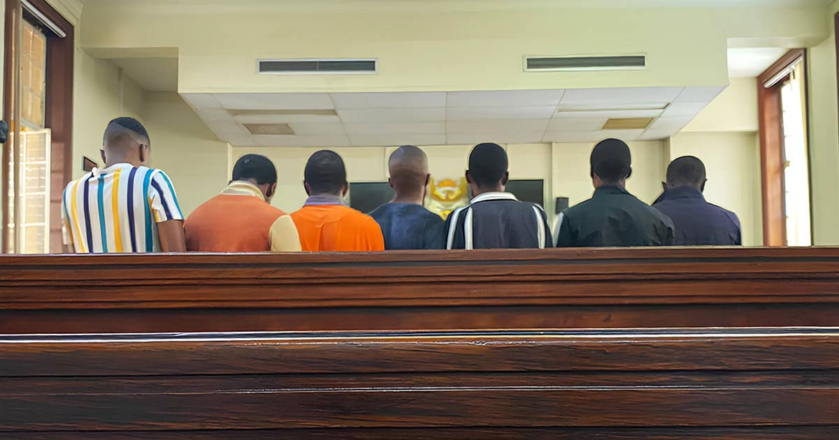 A photo of the seven men accused of being part of the Grindr gang in court