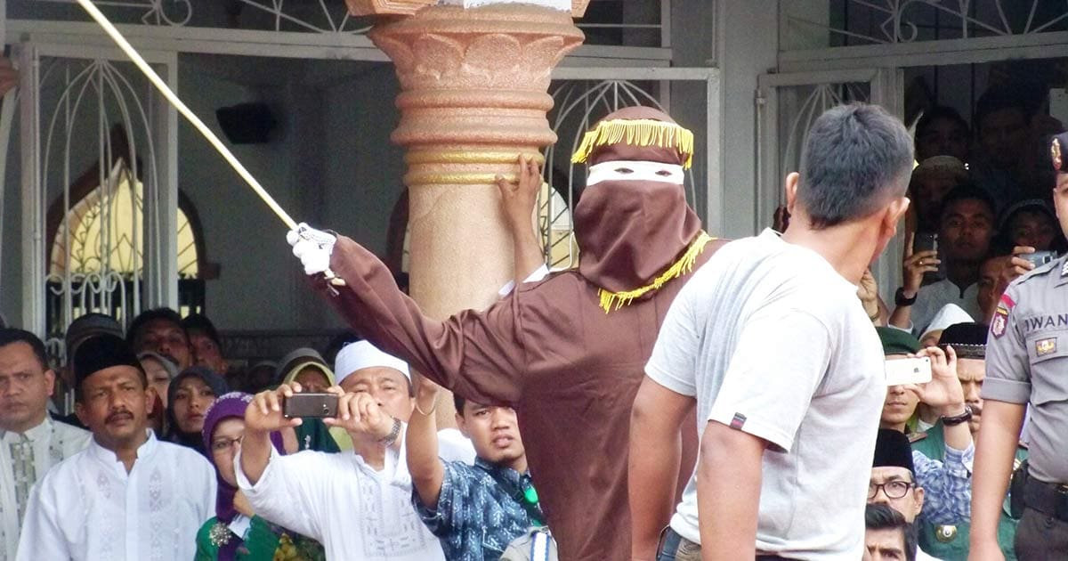 An image of a man being publicly caned in 2014 in Indonesia, in the city of Banda Aceh, where same-sex intimacy is illegal under local Sharia law.