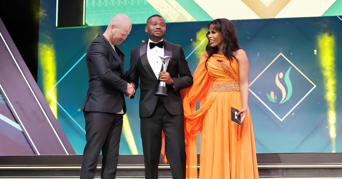 Former out male gay footballer Phuti Lekoloane on stage to receive the Sport Volunteer of the Year award at the South African Sport Awards